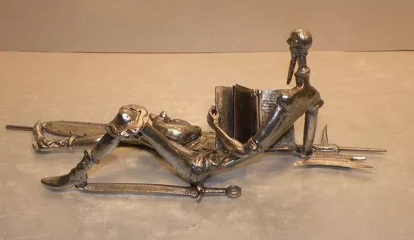 Don quichotte lying  with a  book