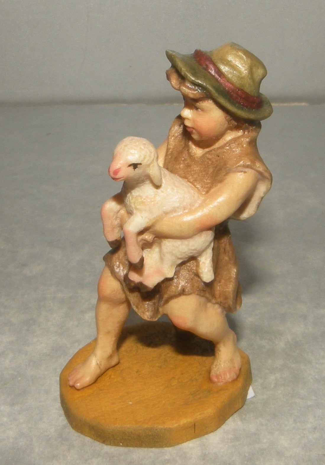 Child with lamb, Rustic