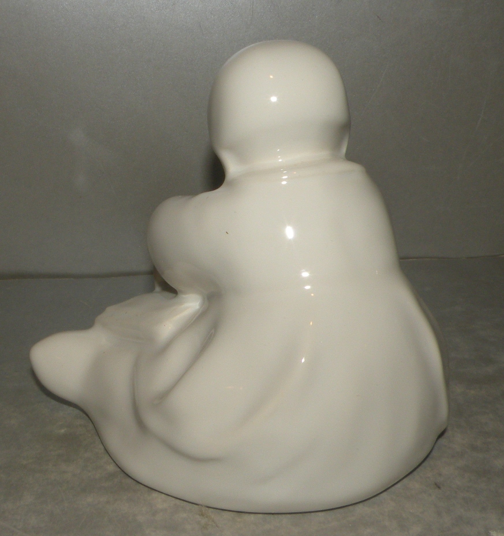Baby with a book, white enamel- by Berthe Savigny, HB-Henriot