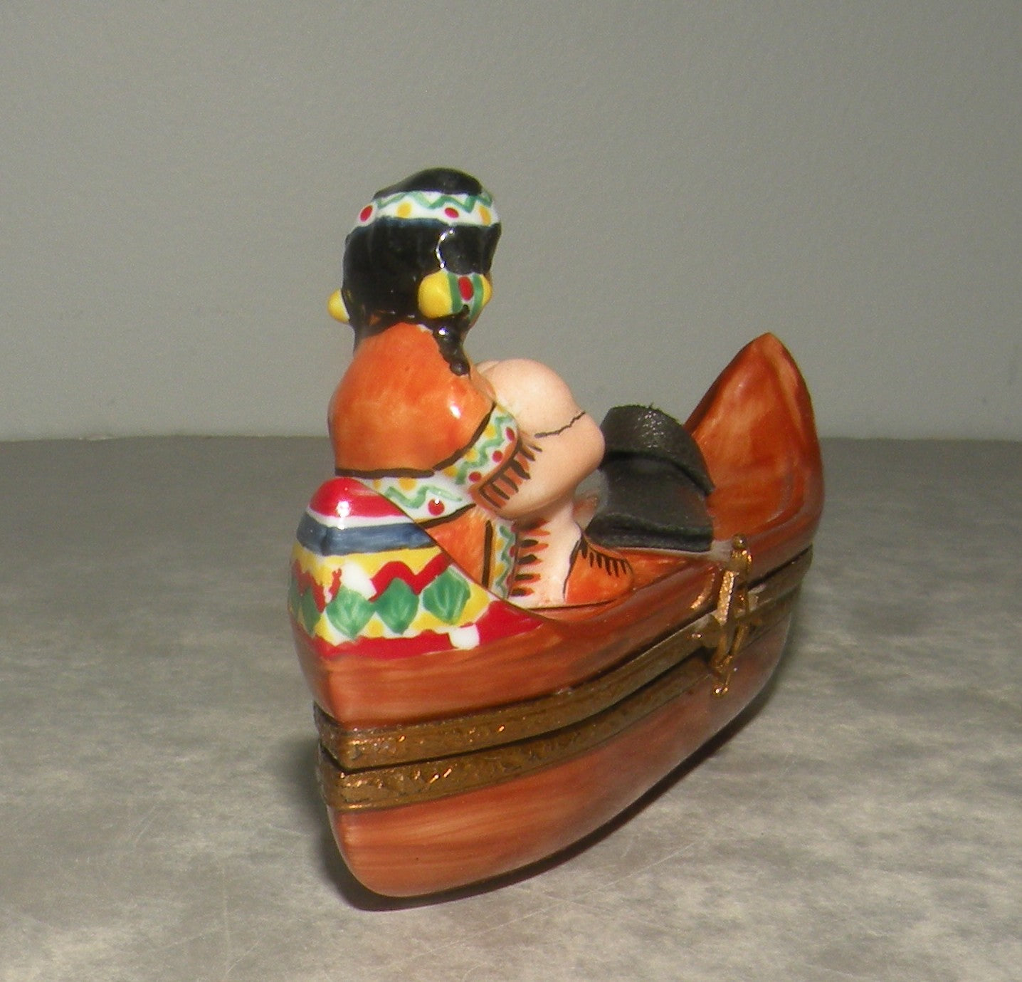 Indian woman on a canoe , Limoges Box number 22