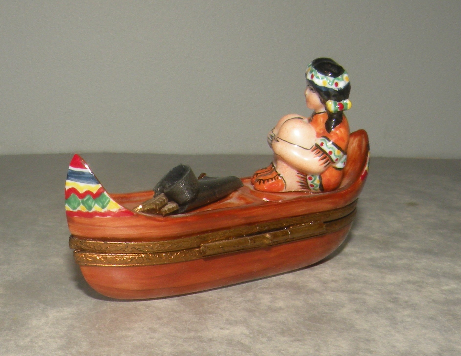 Indian woman on a canoe , Limoges Box number 22