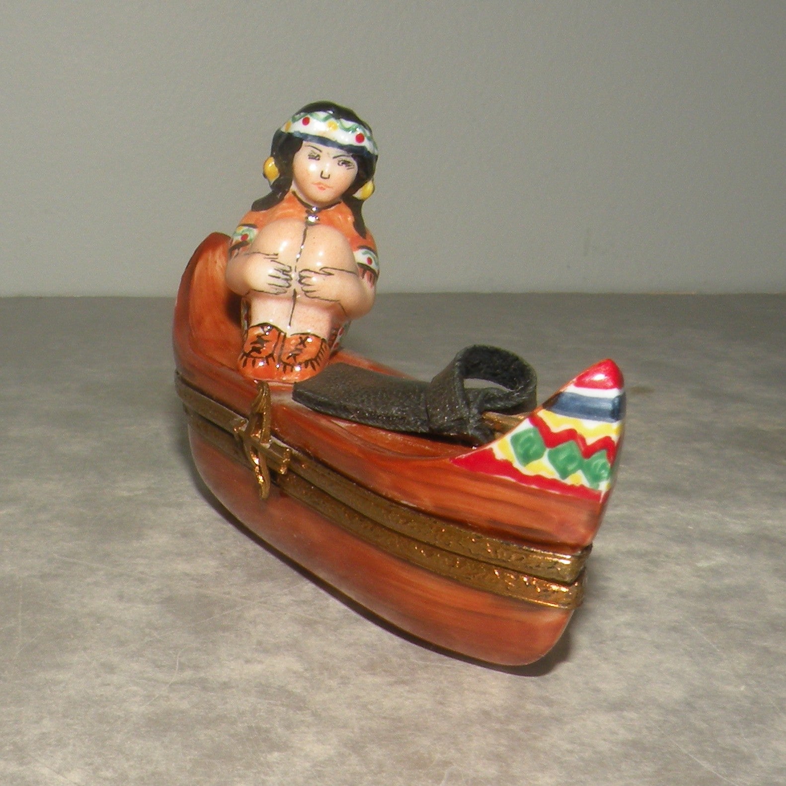 Indian woman on a canoe , Limoges Box number 22