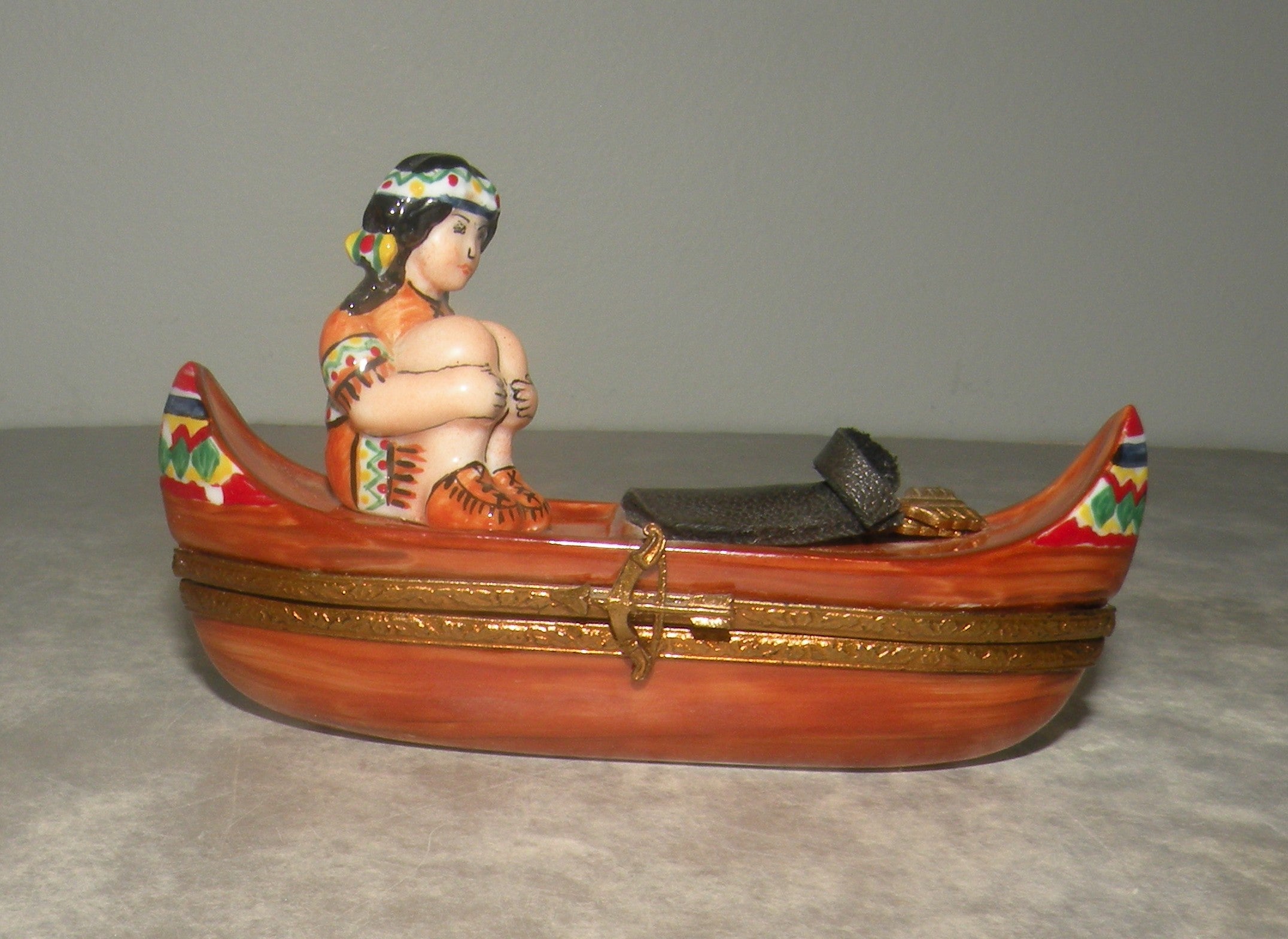 Indian woman on a canoe , Limoges Box number 22