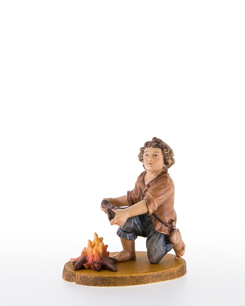 Child kneeling near the fireplace , Lepi
