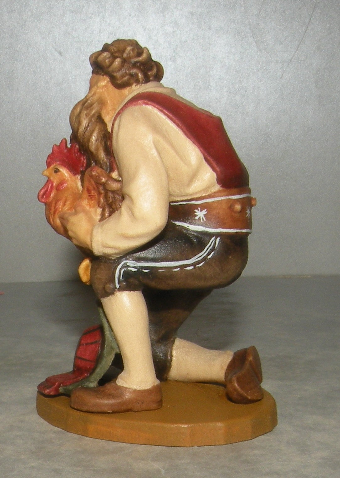 Shepherd kneeling with cock, Folkloristic