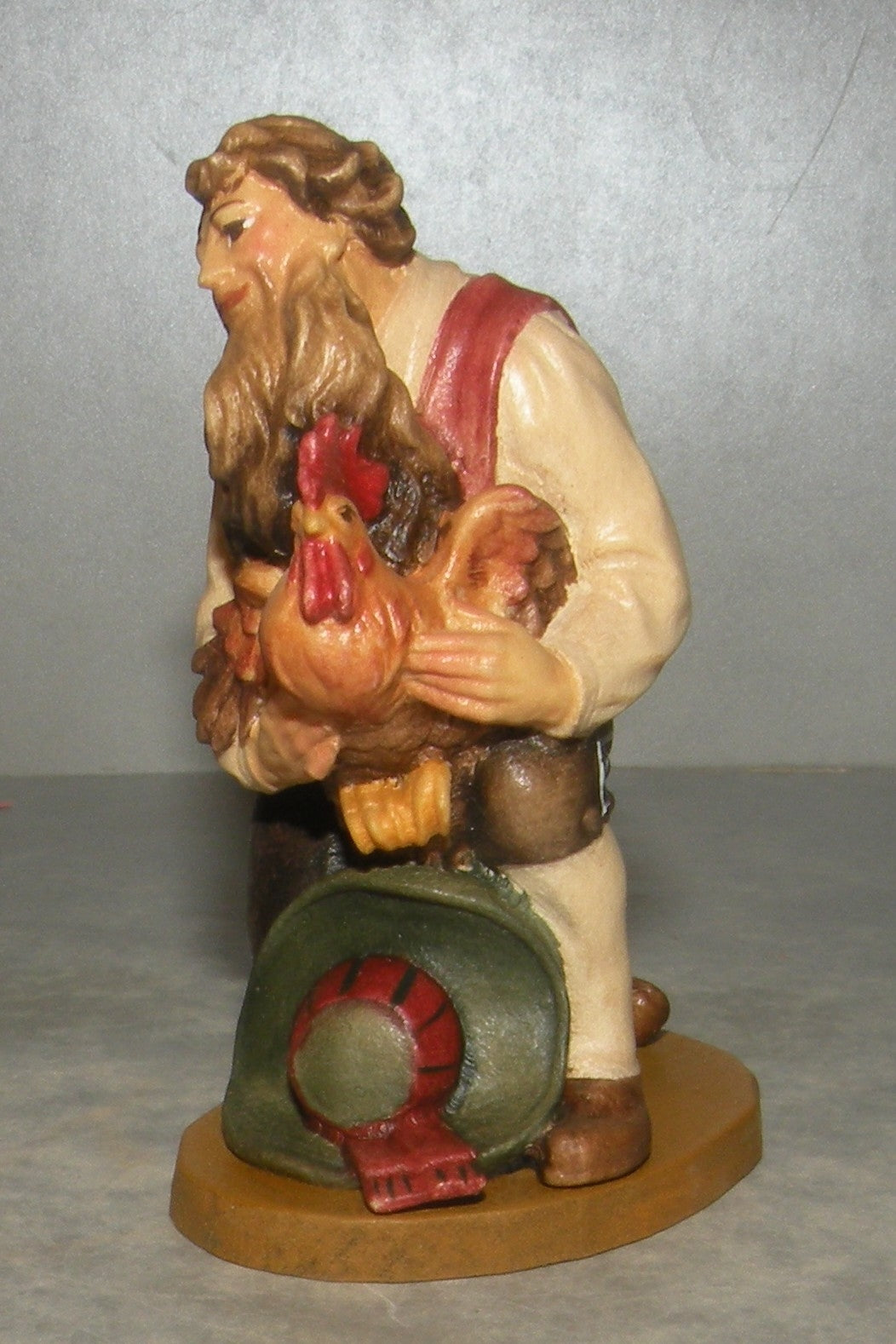Shepherd kneeling with cock, Folkloristic
