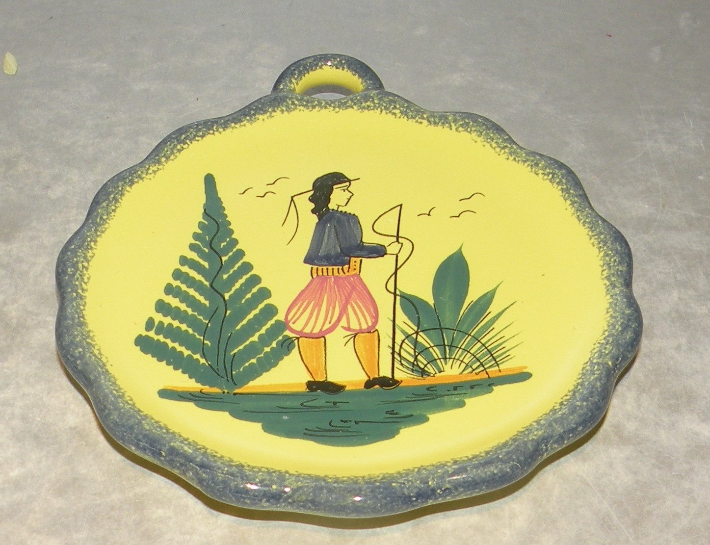 Dish with handle with a man , Soleil Yellow
