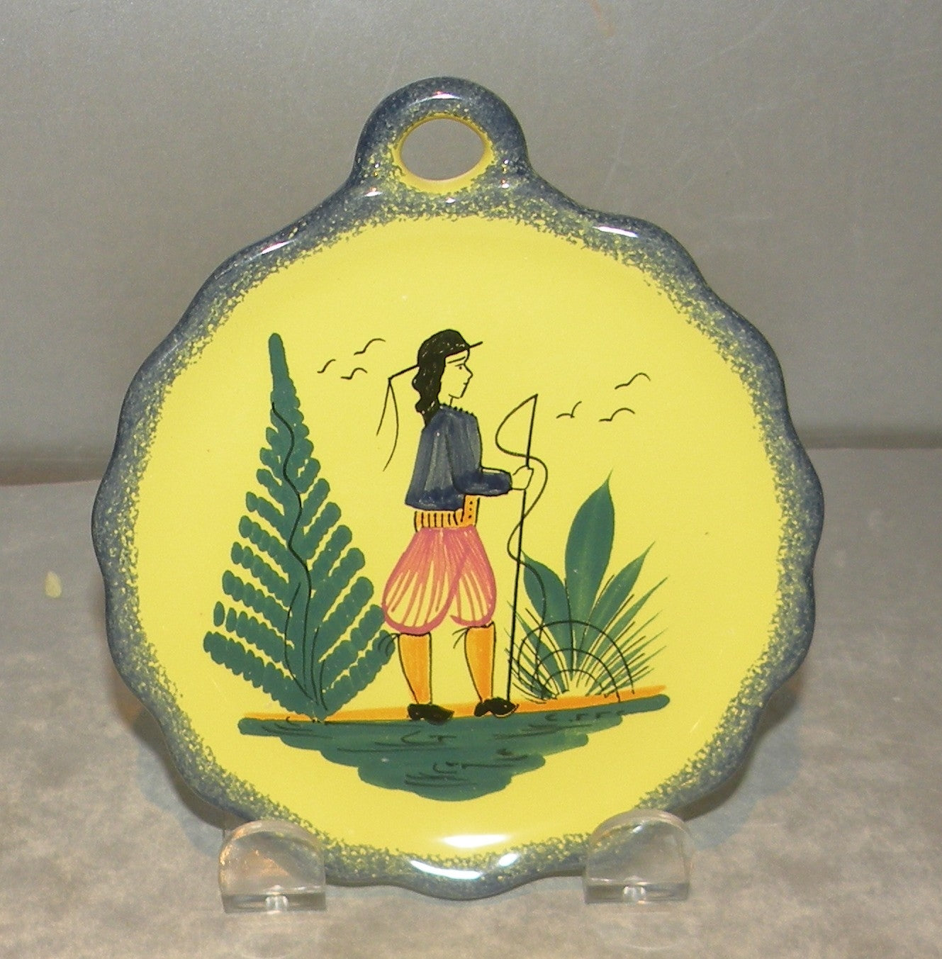 Dish with handle with a man , Soleil Yellow