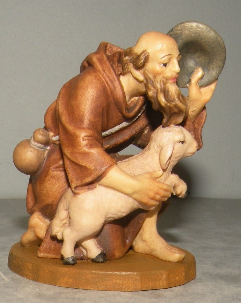 Shepherd kneeling with lamb , Lepi