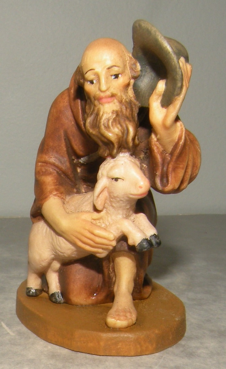 Shepherd kneeling with lamb , Lepi